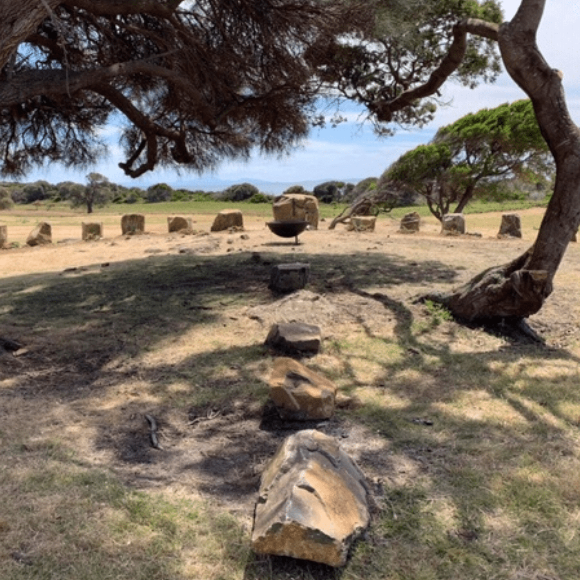 Cultural Heritage Site Aboriginal ranger with fire hose conducting cultural burning for land management