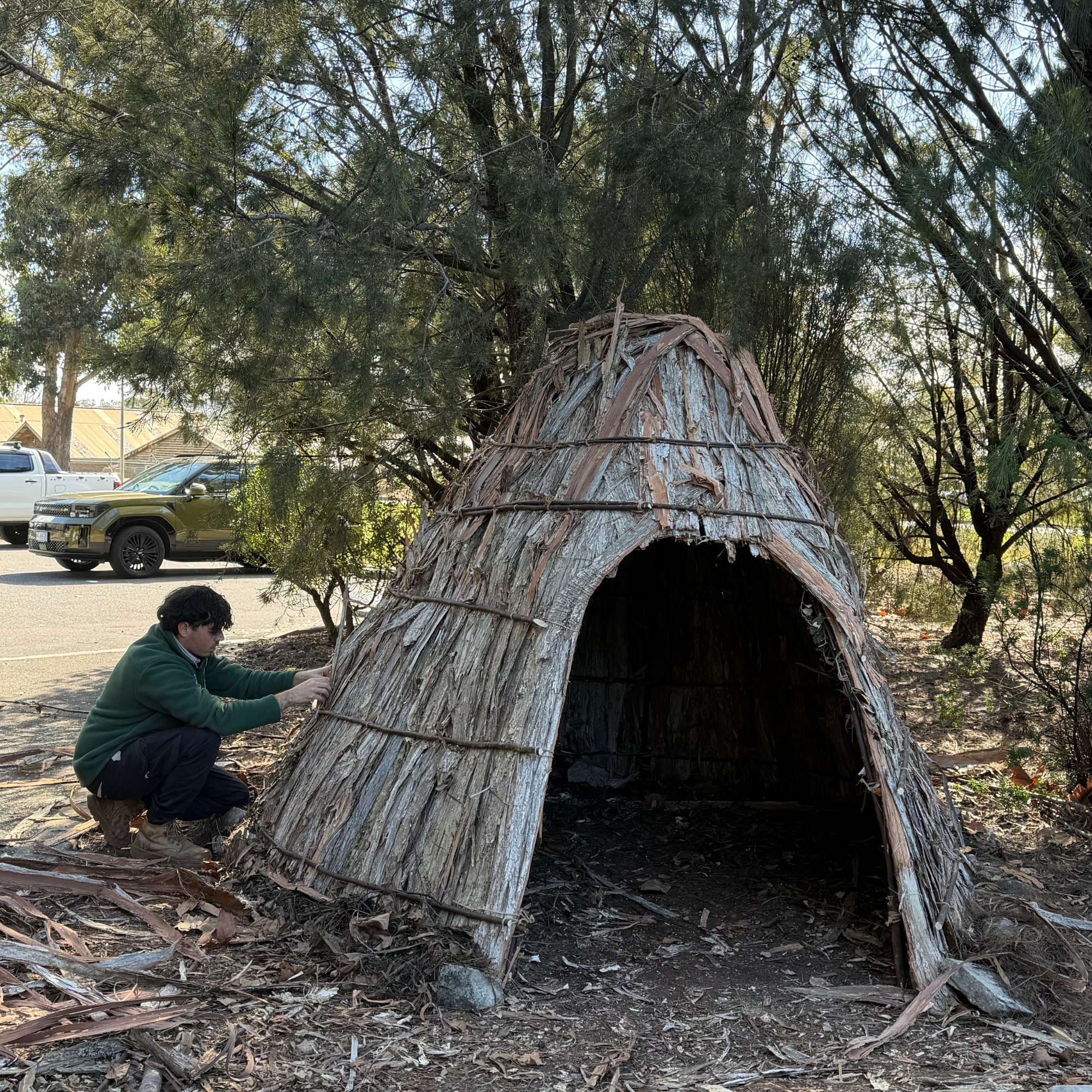 Supporting Community Education Aboriginal ranger with fire hose conducting cultural burning for land management